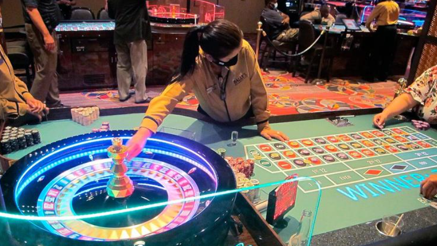 A dealer conducting a roulette game